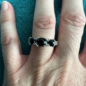 Past, present, future black round cut ring